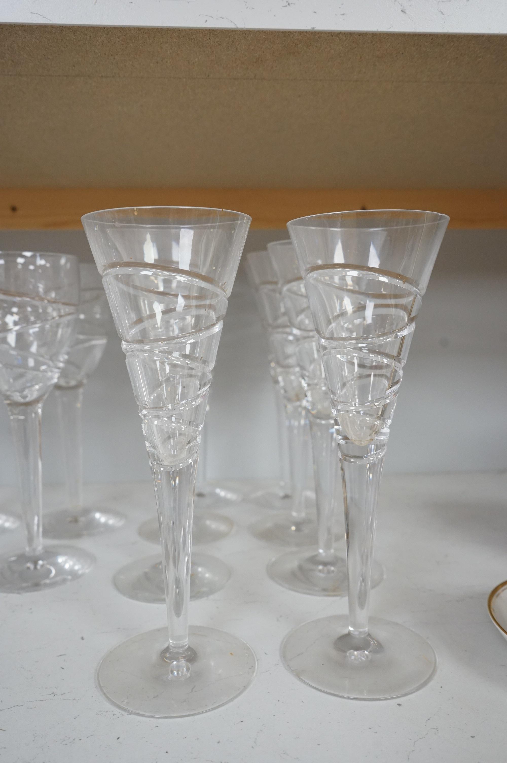 Various part suites of Jasper Conran hand cut Stuart Crystal ‘Aura’ glasses. Including eight Champagne, five large wine and six smaller wine glasses and a carafe, largest 27cm high
